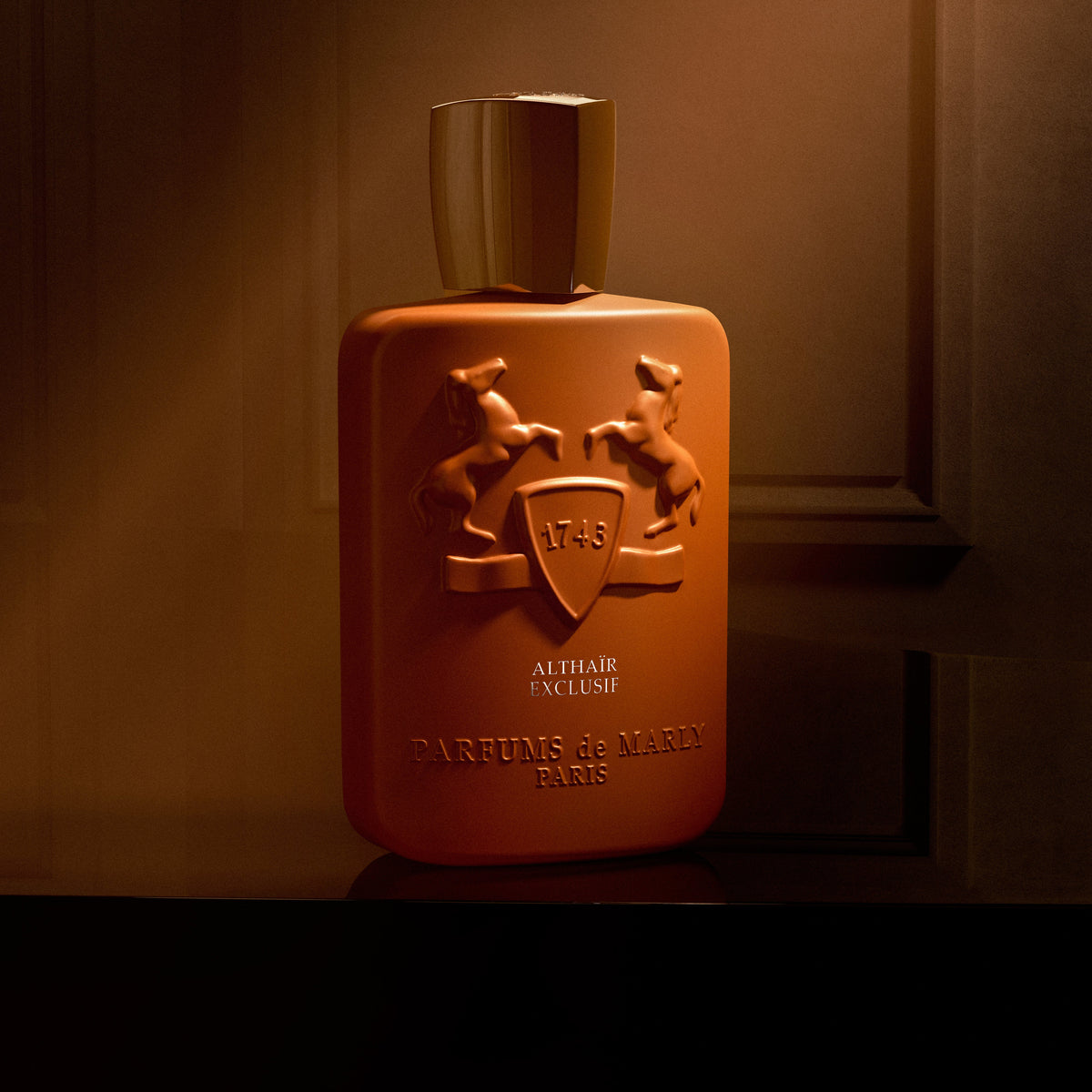 Althaïr Exclusif bottle detail in warm light — official brand image