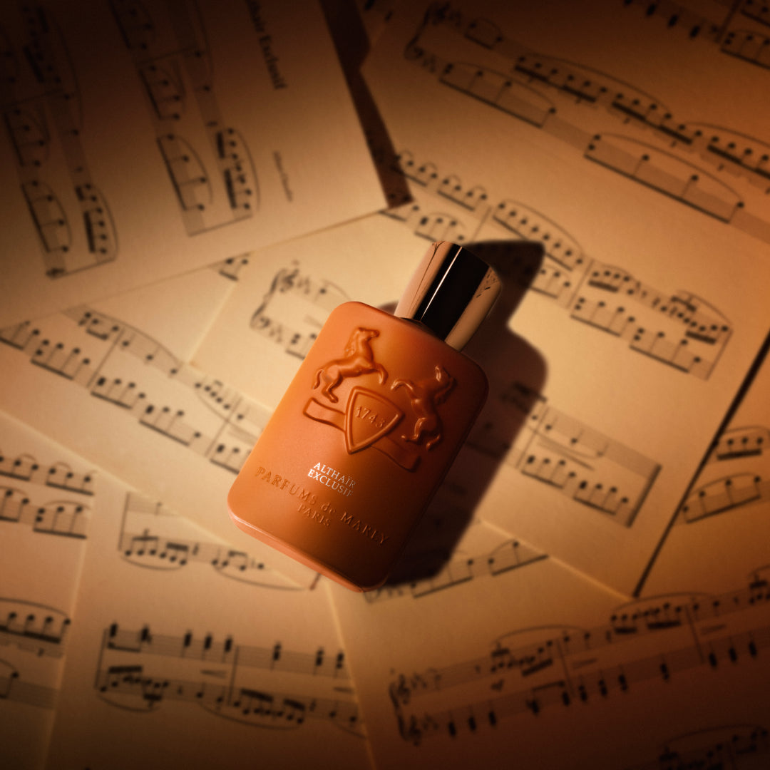 Althaïr Exclusif bottle on sheet music — official brand image