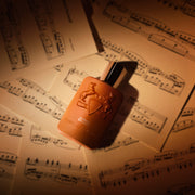 Althaïr Exclusif bottle on sheet music — official brand image