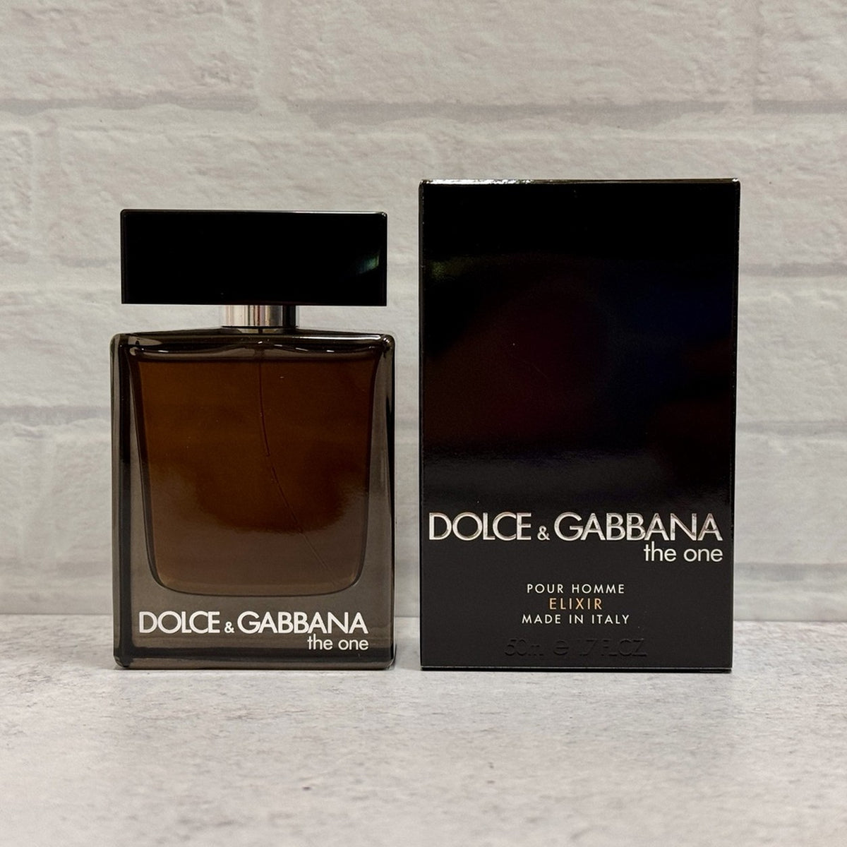 Dolce & Gabbana The One Pour Homme Elixir bottle and original box; fragrance reference for independently prepared samples
