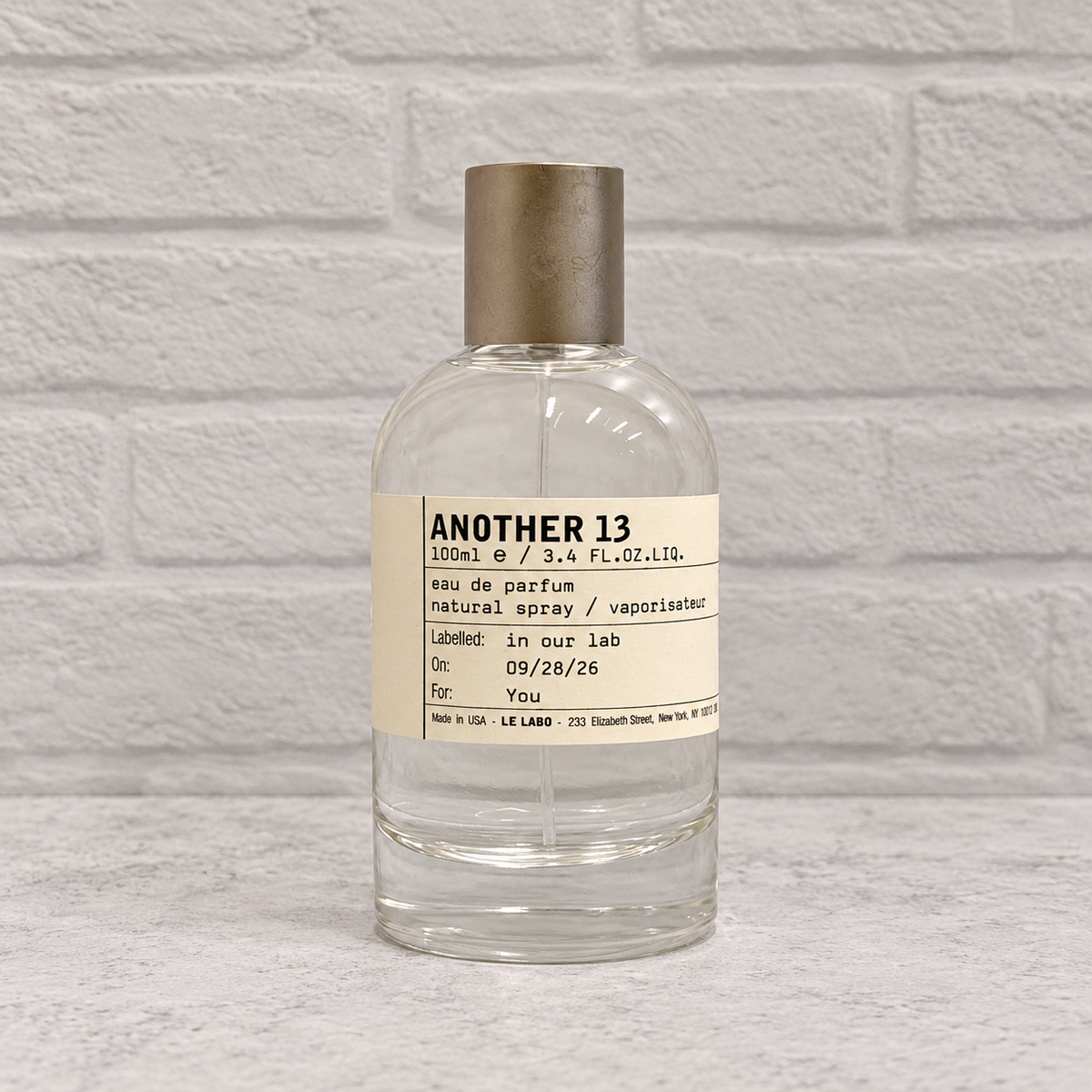 Another 13 tester bottle with cap, front view