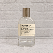 Another 13 tester bottle with cap, front view