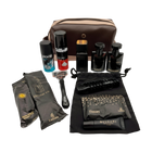 Grooming kit with various items including a bag, bottles, and a razor on a white background